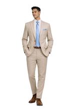 Load image into Gallery viewer, Man wearing a beige suit with a blue tie on a white background