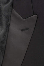 Load image into Gallery viewer, Close-up of a black tuxedo jacket with a peak lapel.